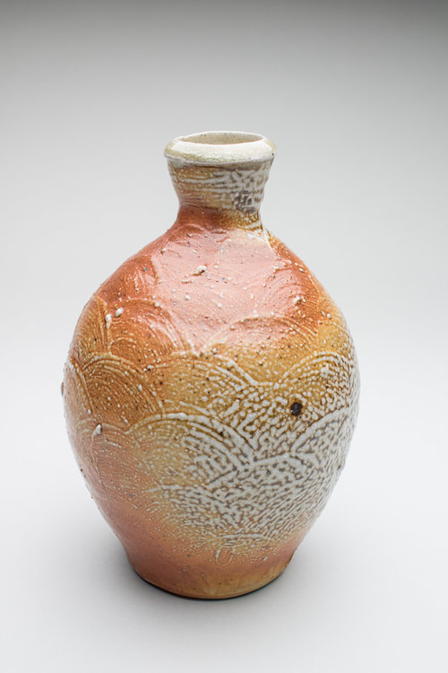 A grey and orange vase
